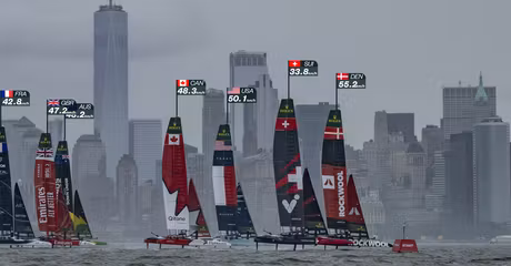 ROCKWOOL Denmark SailGP Team helmed by Nicolai Sehested and Switzerland SailGP Team helmed by Sebastien Schneiter lead the fleet past the One World Trade Centre and New York City skyline on Race Day 1 of the Mubadala New York Sail Grand Prix in New York, USA. Saturday 7 June 2025