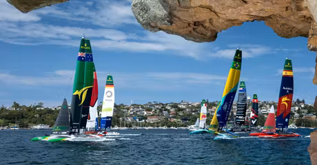 The fleet led by Australia SailGP Team helmed by Tom Slingsby with Canada NorthStar SailGP Team, Germany SailGP Team, Mubadala Brazil SailGP Team and Spain SailGP Team as seen from Shark Island on Race Day 1 of the KPMG Australia Sail Grand Prix in Sydney, Australia. Saturday 8 February 2025