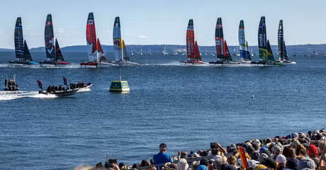 The SailGP F50 catamaran fleet is led by the France SailGP F50 catamaran helmed by Quentin Delapierre in-front of the SailGP Grandstand and SailGP Race Stadium on Race Day 2 of the Germany Sail Grand Prix in Sassnitz, Germany. Sunday 17 August 2025