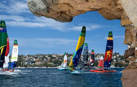 The fleet led by Australia SailGP Team helmed by Tom Slingsby with Canada NorthStar SailGP Team, Germany SailGP Team, Mubadala Brazil SailGP Team and Spain SailGP Team as seen from Shark Island on Race Day 1 of the KPMG Australia Sail Grand Prix in Sydney, Australia. Saturday 8 February 2025