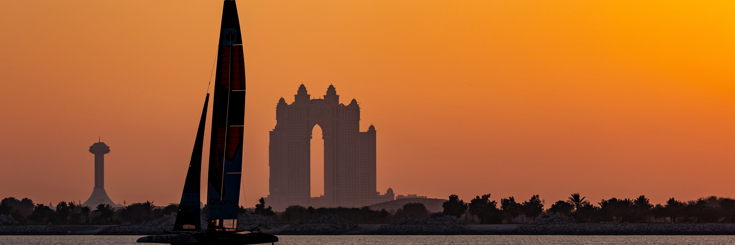NORTHSTAR SailGP Team helmed by Giles Scott sail past the Atlantis during a practice session at sunset ahead of the Mubadala Abu Dhabi Sail Grand Prix 2025 Season Grand Final presented by Abu Dhabi Sports Council held in Abu Dhabi, United Arab Emirates, Thursday 27 November 2025