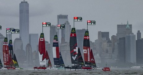 ROCKWOOL Denmark SailGP Team helmed by Nicolai Sehested and Switzerland SailGP Team helmed by Sebastien Schneiter lead the fleet past the One World Trade Centre and New York City skyline on Race Day 1 of the Mubadala New York Sail Grand Prix in New York, USA. Saturday 7 June 2025