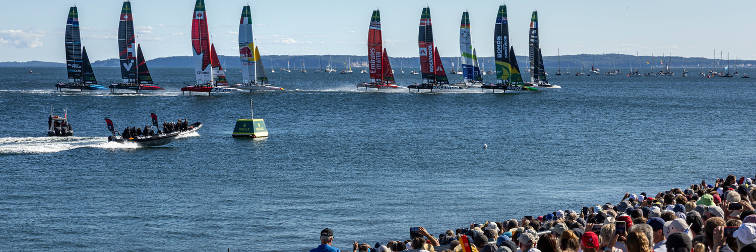 The SailGP F50 catamaran fleet is led by the France SailGP F50 catamaran helmed by Quentin Delapierre in-front of the SailGP Grandstand and SailGP Race Stadium on Race Day 2 of the Germany Sail Grand Prix in Sassnitz, Germany. Sunday 17 August 2025