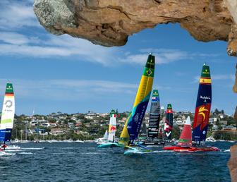 The fleet led by Australia SailGP Team helmed by Tom Slingsby with Canada NorthStar SailGP Team, Germany SailGP Team, Mubadala Brazil SailGP Team and Spain SailGP Team as seen from Shark Island on Race Day 1 of the KPMG Australia Sail Grand Prix in Sydney, Australia. Saturday 8 February 2025