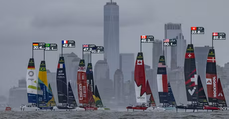 ROCKWOOL Denmark SailGP Team helmed by Nicolai Sehested and Switzerland SailGP Team helmed by Sebastien Schneiter lead the fleet past the One World Trade Centre and New York City skyline on Race Day 1 of the Mubadala New York Sail Grand Prix in New York, USA. Saturday 7 June 2025