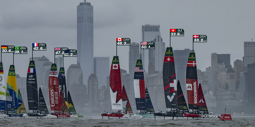 ROCKWOOL Denmark SailGP Team helmed by Nicolai Sehested and Switzerland SailGP Team helmed by Sebastien Schneiter lead the fleet past the One World Trade Centre and New York City skyline on Race Day 1 of the Mubadala New York Sail Grand Prix in New York, USA. Saturday 7 June 2025