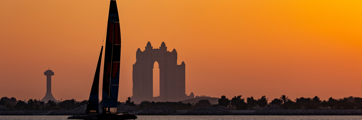NORTHSTAR SailGP Team helmed by Giles Scott sail past the Atlantis during a practice session at sunset ahead of the Mubadala Abu Dhabi Sail Grand Prix 2025 Season Grand Final presented by Abu Dhabi Sports Council held in Abu Dhabi, United Arab Emirates, Thursday 27 November 2025