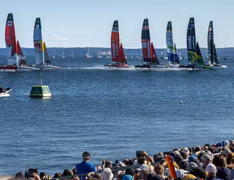 The SailGP F50 catamaran fleet is led by the France SailGP F50 catamaran helmed by Quentin Delapierre in-front of the SailGP Grandstand and SailGP Race Stadium on Race Day 2 of the Germany Sail Grand Prix in Sassnitz, Germany. Sunday 17 August 2025
